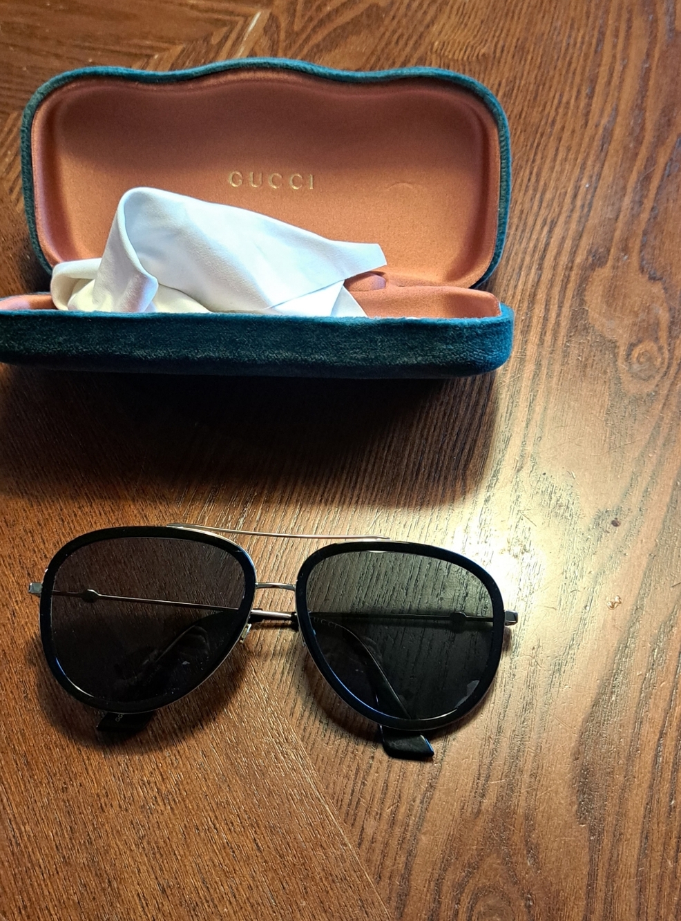 GUCCI Gold and Blacj Aviator Sunglasses with Grey-Green lenses color.